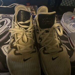 Nike Black and White Athletic Shoes with High-Top Design